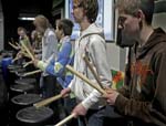 row of kids drumming